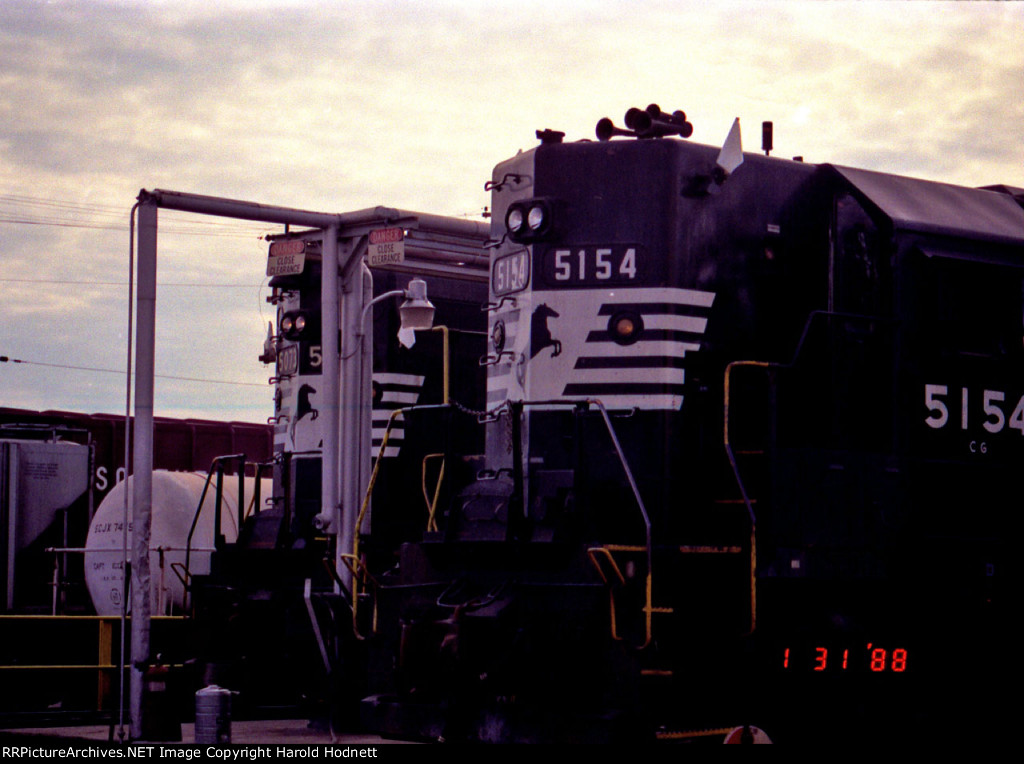 NS 5073 & 5154 at the fuel racks, with white flags